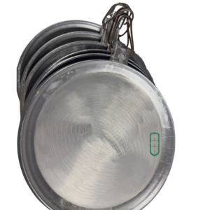 Aluminium chapati pans stacked showing graduated sizes and wire handles, Juakali Kenya