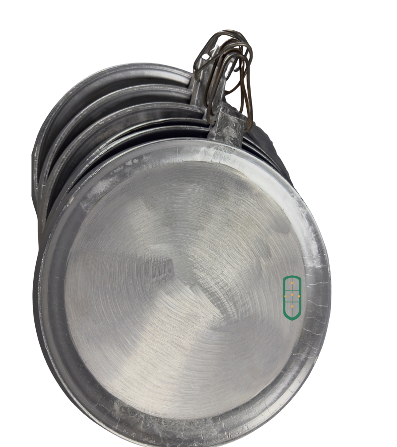 Aluminium chapati pans stacked showing graduated sizes and wire handles, Juakali Kenya
