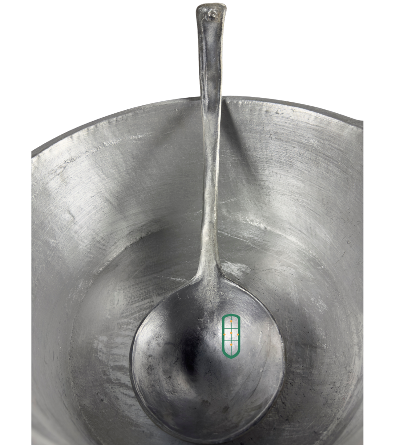 Large cast aluminium serving spoon inside sufuria showing scale of handle and bowl size, Juakali Kenya