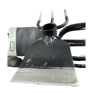 Combined jembe angled view showing dual hoe blades and fork tines construction, handmade Kenya
