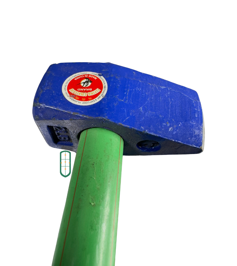 2LB mason hammer head close up showing weight marking and green fibreglass handle, Kenya